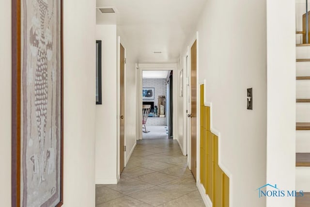 4426 Sheraton Rd, Ottawa Hills, OH 43615 - hallway with baseboards and light tile patterned flooring