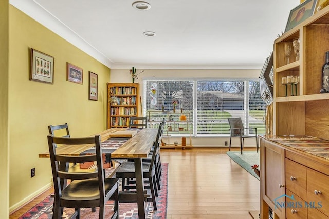 4426 Sheraton Rd, Ottawa Hills, OH 43615 - dining area featuring crown molding, wood finished floors, and baseboards