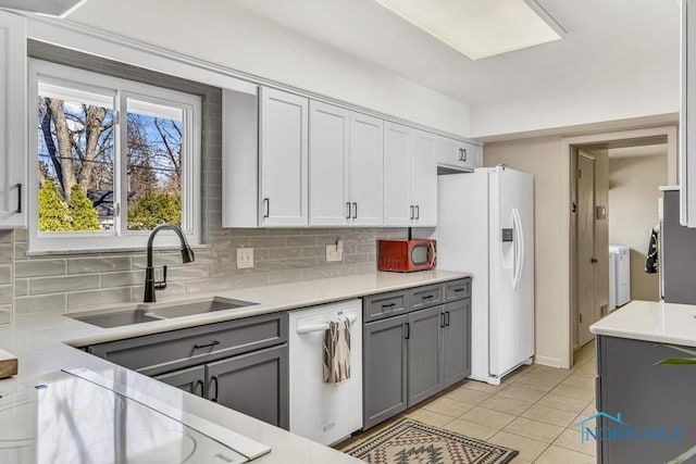 4426 Sheraton Rd, Ottawa Hills, OH 43615 - kitchen featuring white appliances, gray cabinetry, a sink, decorative backsplash, and light countertops
