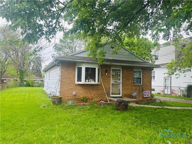 1217 Freedom St, Toledo, OH 43605 - view of front of house featuring brick siding