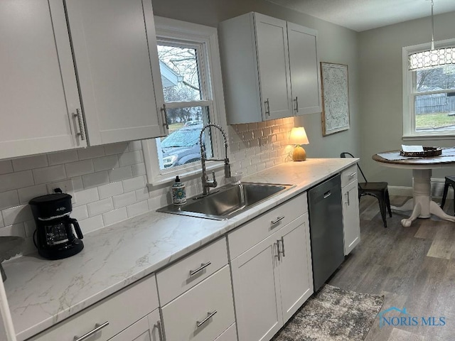 613 W Yeasting St, Gibsonburg, OH 43431 - kitchen featuring a sink, black dishwasher, plenty of natural light, and white cabinets