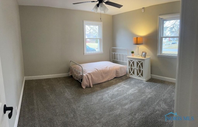 613 W Yeasting St, Gibsonburg, OH 43431 - carpeted bedroom featuring baseboards and ceiling fan