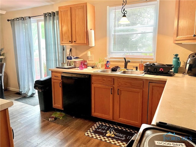 405 W Richards Rd, Toledo, OH 43607 - kitchen with dishwasher, a sink, dark wood finished floors, and light countertops
