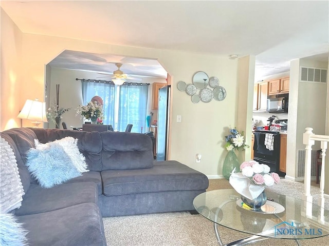 405 W Richards Rd, Toledo, OH 43607 - living area with arched walkways, a ceiling fan, and baseboards