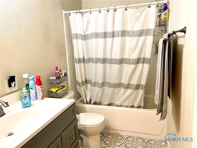 405 W Richards Rd, Toledo, OH 43607 - bathroom featuring shower / tub combo with curtain, toilet, a textured wall, vanity, and tile patterned flooring