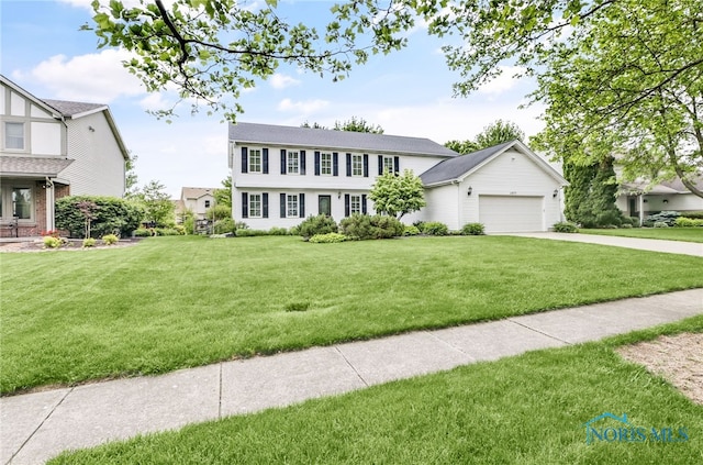 1977 Lexington Dr, Perrysburg, OH 43551 - colonial home with a garage, a front yard, and driveway
