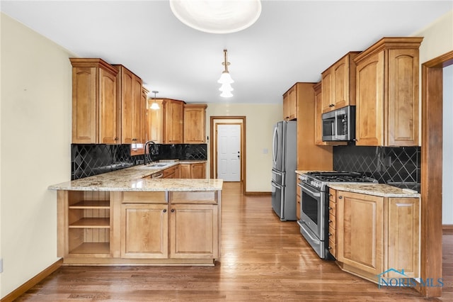1977 Lexington Dr, Perrysburg, OH 43551 - kitchen featuring stainless steel appliances, baseboards, backsplash, and light stone counters