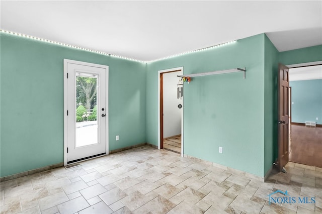 1977 Lexington Dr, Perrysburg, OH 43551 - empty room featuring stone finish flooring and baseboards