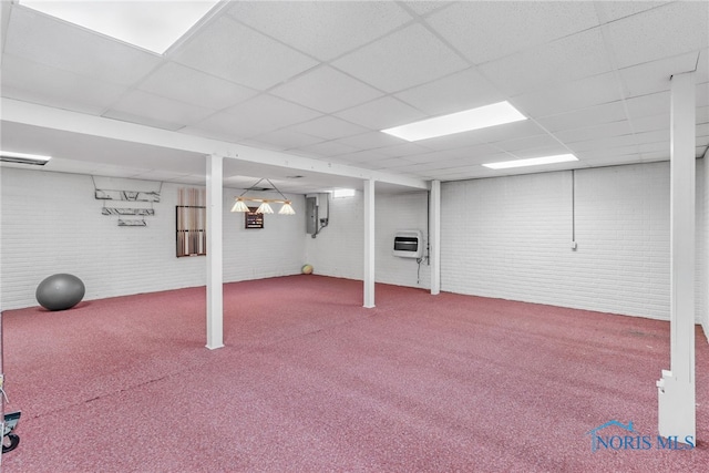 1977 Lexington Dr, Perrysburg, OH 43551 - finished basement featuring brick wall, carpet floors, a paneled ceiling, heating unit, and electric panel