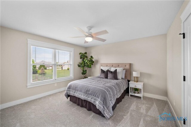 5653 Mallard Pointe Ln, Sylvania, OH 43560 - carpeted bedroom featuring baseboards and ceiling fan