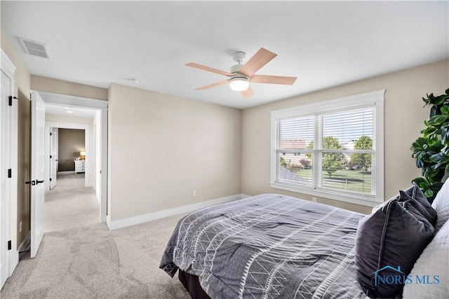5653 Mallard Pointe Ln, Sylvania, OH 43560 - bedroom featuring light carpet, baseboards, and a ceiling fan