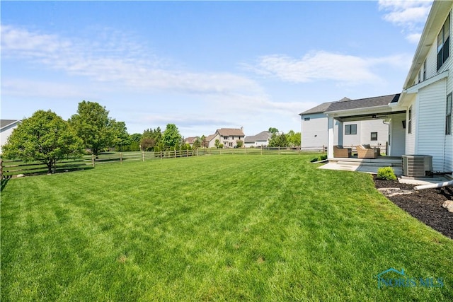 5653 Mallard Pointe Ln, Sylvania, OH 43560 - view of yard featuring outdoor lounge area, a ceiling fan, and cooling unit