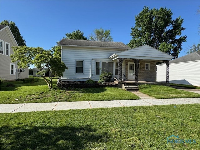 651 Park St, Napoleon, OH 43545 - view of front of property featuring a front lawn