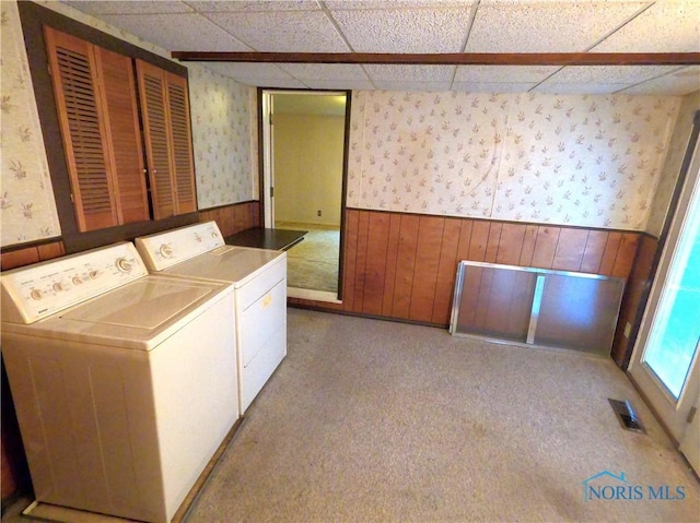 651 Park St, Napoleon, OH 43545 - laundry area featuring wallpapered walls, washing machine and dryer, wainscoting, wooden walls, and carpet floors