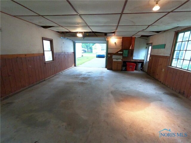 651 Park St, Napoleon, OH 43545 - garage with wooden walls and a wainscoted wall