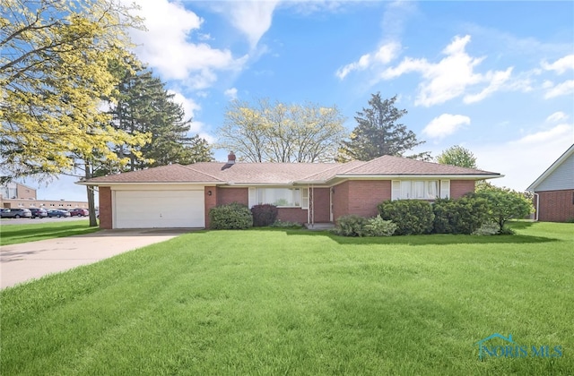 403 S N Curtice Rd, Oregon, OH 43616 - single story home with brick siding, an attached garage, driveway, a front lawn, and a chimney