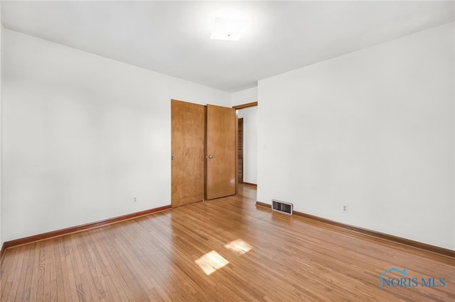 403 S N Curtice Rd, Oregon, OH 43616 - empty room with light wood-style floors and baseboards