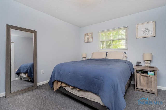 carpeted bedroom with baseboards