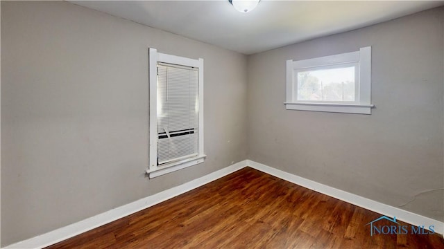701 Brighton Ave, Toledo, OH 43609 - unfurnished room with baseboards and wood finished floors