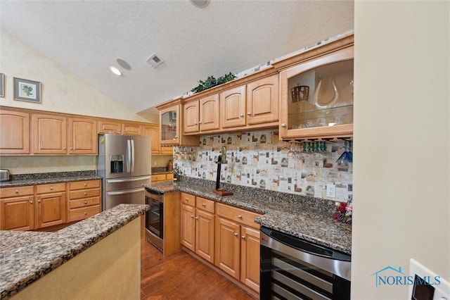 2730 Canterbury Cir Unit 23B, Port Clinton, OH 43452 - kitchen with stainless steel fridge with ice dispenser, wine cooler, vaulted ceiling, glass insert cabinets, and wood finished floors