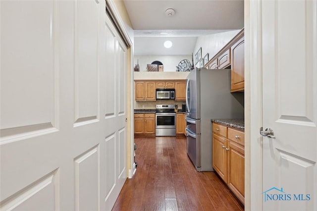 2730 Canterbury Cir Unit 23B, Port Clinton, OH 43452 - kitchen featuring stainless steel appliances, dark wood-style flooring, brown cabinets, and recessed lighting