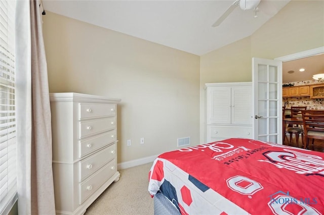 2730 Canterbury Cir Unit 23B, Port Clinton, OH 43452 - bedroom with lofted ceiling, light colored carpet, baseboards, and ceiling fan