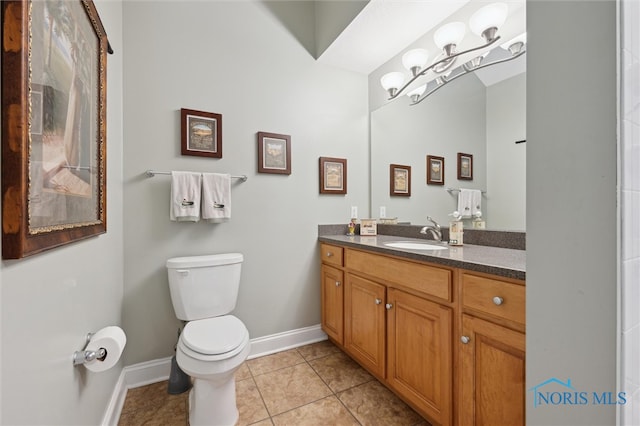 2730 Canterbury Cir Unit 23B, Port Clinton, OH 43452 - bathroom with toilet, baseboards, tile patterned floors, vanity, and a chandelier