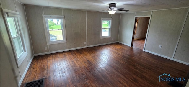 1037 Fishlock Ave, Findlay, OH 45840 - unfurnished room featuring wood-type flooring, baseboards, ceiling fan, and ornamental molding