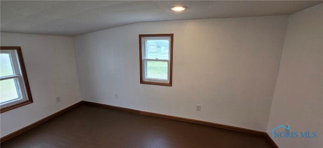 1037 Fishlock Ave, Findlay, OH 45840 - unfurnished room featuring baseboards, dark colored carpet, lofted ceiling, and recessed lighting