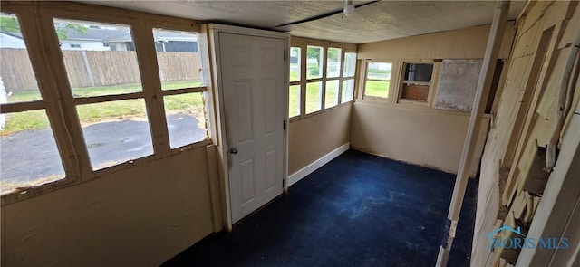 1037 Fishlock Ave, Findlay, OH 45840 - unfurnished sunroom featuring unfinished concrete flooring