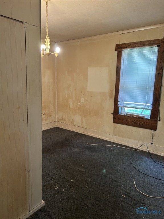 701 E Wayne St, Paulding, OH 45879 - unfurnished room featuring dark colored carpet