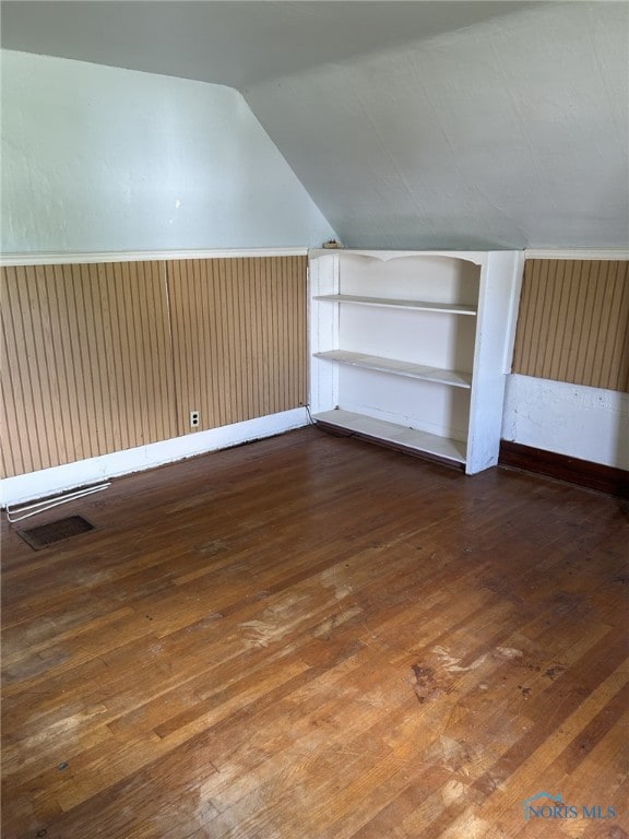 701 E Wayne St, Paulding, OH 45879 - bonus room with hardwood / wood-style floors, lofted ceiling, and baseboards