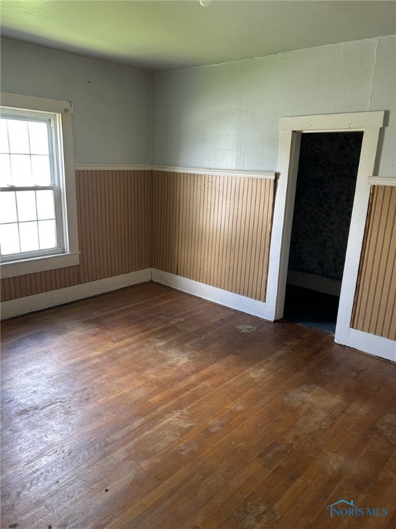 701 E Wayne St, Paulding, OH 45879 - empty room with hardwood / wood-style floors