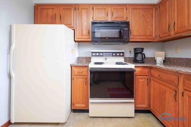 2023 Bluestone Dr, Findlay, OH 45840 - kitchen featuring white appliances, brown cabinetry, and stone countertops