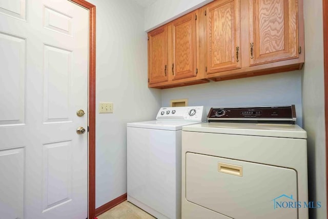 2023 Bluestone Dr, Findlay, OH 45840 - clothes washing area featuring independent washer and dryer, cabinet space, and baseboards