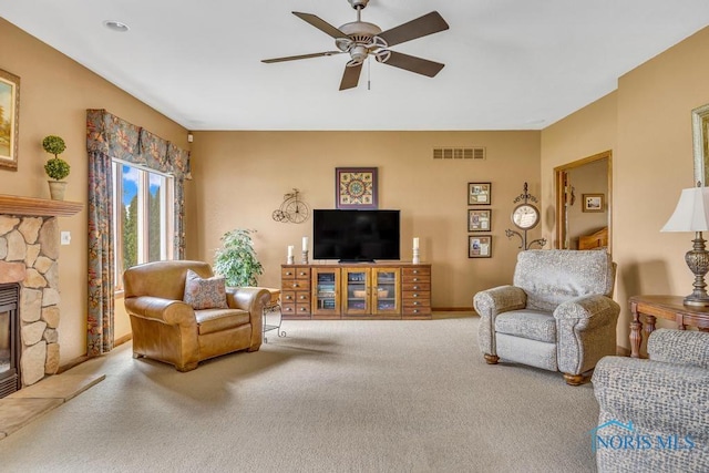 14360 County Road 2, Swanton, OH 43558 - carpeted living room with a ceiling fan and a stone fireplace