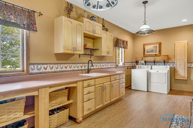 14360 County Road 2, Swanton, OH 43558 - laundry room featuring washing machine and dryer, cabinet space, healthy amount of natural light, light wood-style flooring, and recessed lighting