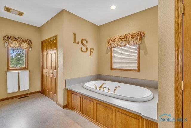 14360 County Road 2, Swanton, OH 43558 - bathroom featuring a bath and tile patterned floors