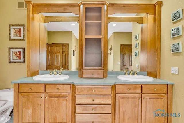 14360 County Road 2, Swanton, OH 43558 - bathroom featuring toilet and double vanity