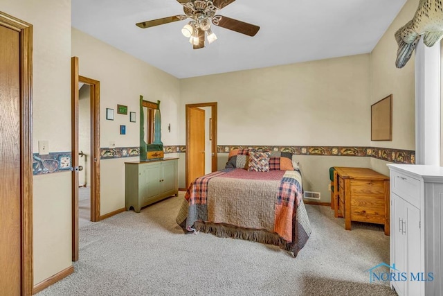 14360 County Road 2, Swanton, OH 43558 - bedroom featuring light carpet, baseboards, and a ceiling fan