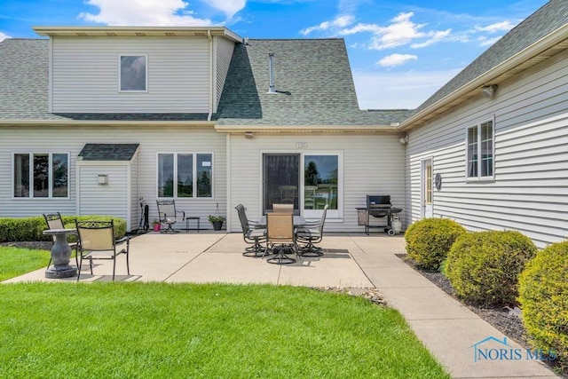14360 County Road 2, Swanton, OH 43558 - rear view of property featuring a yard, a patio area, and roof with shingles
