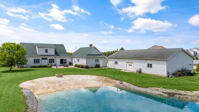 14360 County Road 2, Swanton, OH 43558 - rear view of property featuring an outdoor fire pit, a yard, a patio area, and roof with shingles