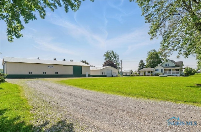 1482 Township Road 55, Ada, OH 45810 - ranch-style home with a front lawn and gravel driveway