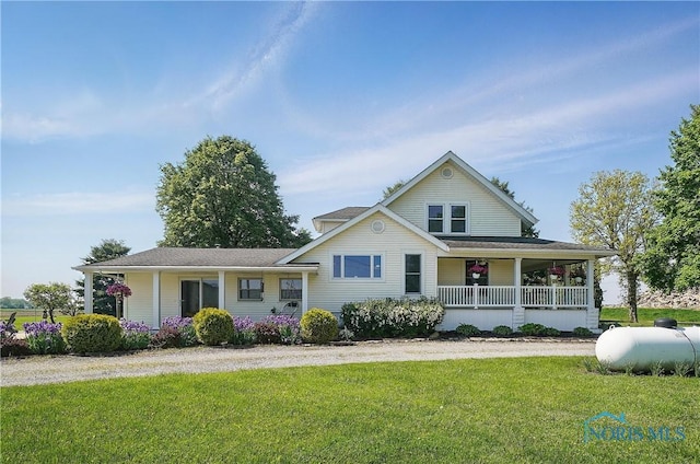 1482 Township Road 55, Ada, OH 45810 - view of front facade featuring covered porch and a front lawn