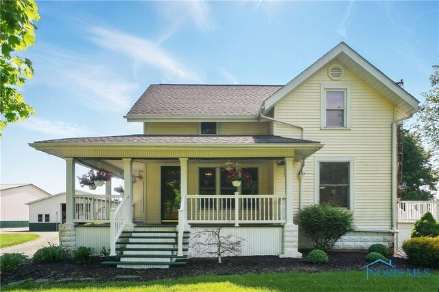 1482 Township Road 55, Ada, OH 45810 - view of front of house featuring covered porch and a shingled roof