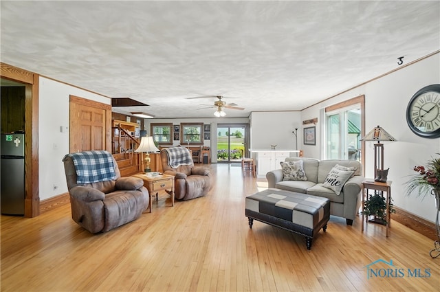 1482 Township Road 55, Ada, OH 45810 - living room with light wood-style flooring, a ceiling fan, and baseboards