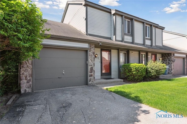 2540 Plum Leaf Ln, Toledo, OH 43614 - view of front of house featuring a garage and asphalt driveway