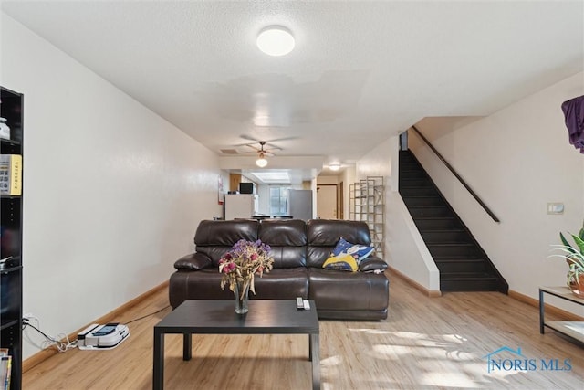 2540 Plum Leaf Ln, Toledo, OH 43614 - living room with stairway, baseboards, ceiling fan, and wood finished floors