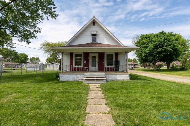344 E Findlay St, Sugar Creek Township, OH 45893 - shotgun-style home featuring a porch