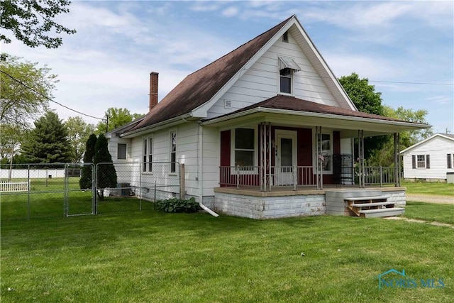 344 E Findlay St, Sugar Creek Township, OH 45893 - view of front of house featuring covered porch, a chimney, and a gate